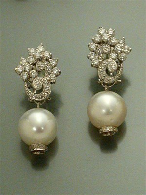 Lot 462 - Pair of Diamond Flower Earrings with Interchangeable Cultured Pearl and Ruby Pendants