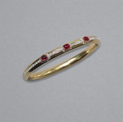 Lot 344 - Gold, Ruby & Diamond Bangle