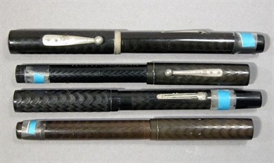 Lot 2289 - Four Waterman Hard Chased Rubber Fountain Pens...