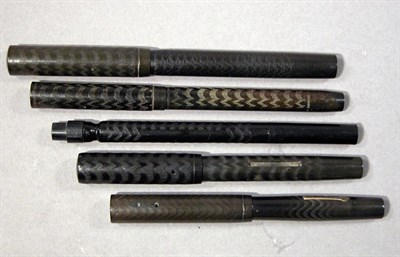 Lot 2224 - Five Assorted Chased Rubber Fountain Pens