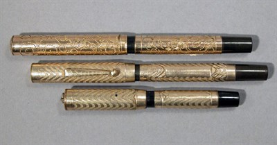 Lot 2248 - Three Gold-Filled Over Black Plastic Fountain...