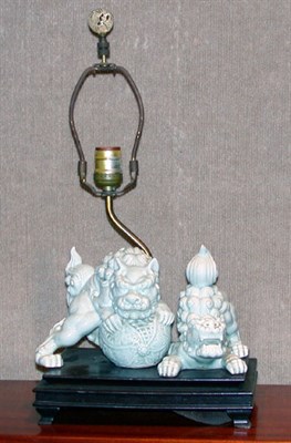 Lot 2209 - Two Japanese Celadon Glazed Porcelain Fu Lions...
