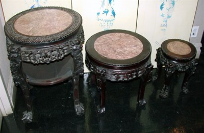 Lot 2146 - Three Chinese Carved Wood Circular Tables Each...