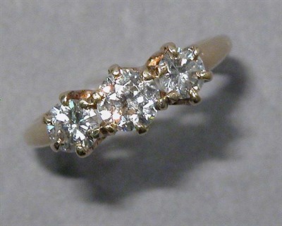 Lot 559 - Gold and Three Stone Diamond Ring