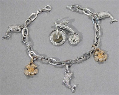 Lot 427 - White Gold and Diamond Bicycle Brooch and Charm Bracelet