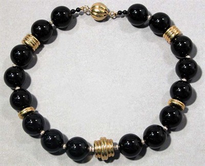 Lot 456 - Gold, Black Onyx Bead and Diamond Necklace