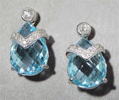 Lot 651 - Pair of Blue Topaz and Diamond Pendant Earrings