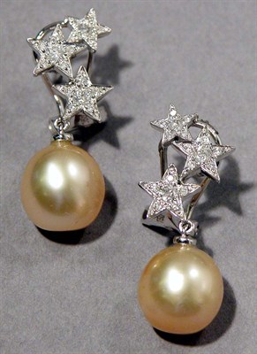Lot 634 - Pair of Golden Cultured Pearl and Diamond Pendant Earrings