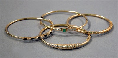 Lot 49 - Four Gold Bangles