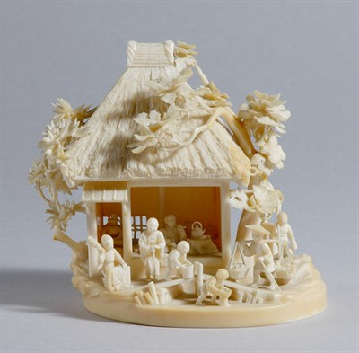 Lot 1032 - Japanese Ivory Okimono of Figures Around a Hut...