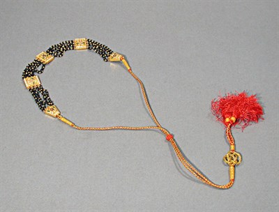 Lot 566 - Indian Gold Plaque and Onyx Bead Choker