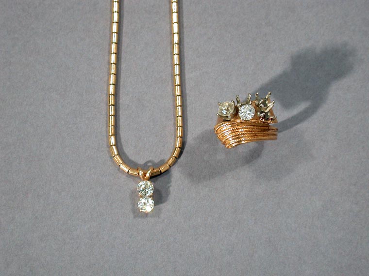 Lot 397 - Gold, Diamond Pendant Necklace and Ring