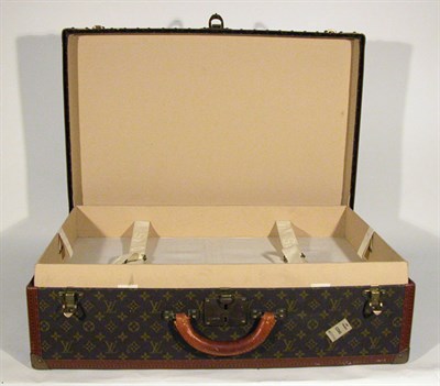 Lot 483 - Louis Vuitton Suitcase LV stamped canvas,...