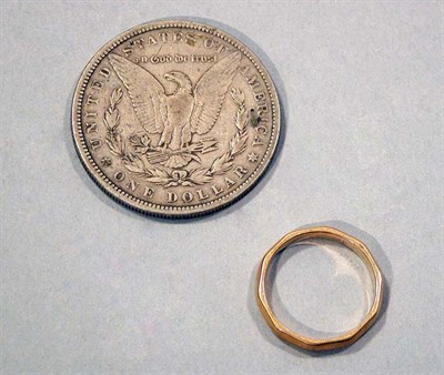 Lot 125 - U.S. Silver Dollar and Yellow Gold Wedding Band