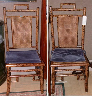 Lot 417 - Set of Four Faux Bamboo and Caned Side Chairs