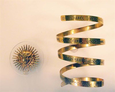 Lot 437 - Chanel Gilt-Metal Slave Bracelet French, mid...