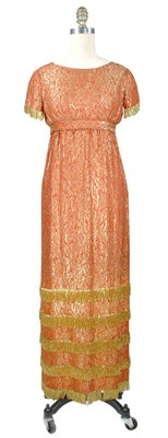 Lot 120 - Norell Tangerine Silk Lame Matelasse Empire...