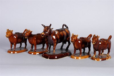 Lot 3142 - Five Brown Glazed Pottery Cow Creamers 19th...