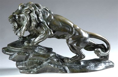 Lot 2291 - Patinated-Bronze Figure Of a roaring lion....