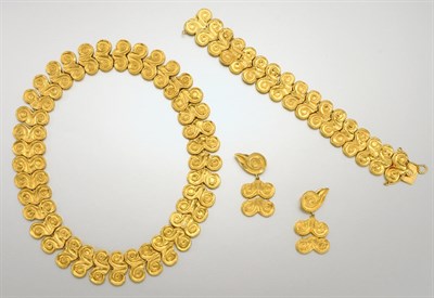 Lot 1457 - Suite of Gold Scroll Jewelry