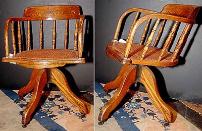 Lot 119 - Pair of Oak and Caned Swivel Base Captain's...