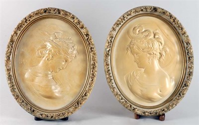 Lot 2425 - Pair of Framed Ivory Tinted Ceramic Cameo...