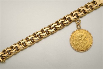 Lot 1002 - Gold Curblink Bracelet with Mexican Coin Charm