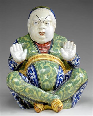 Lot 209 - Faience Model of a Chinese Man Seated with...