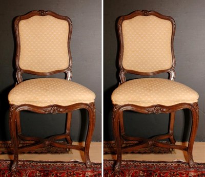 Lot 349 - Eight Regence Style Walnut Dining Chairs
