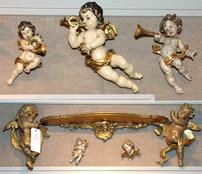 Lot 169 - Thirteen Gilt-Decorated Cherub Figures...