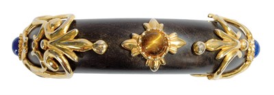 Lot 225 - Canovas Ebony Arabesque Cuff Gilt-metal...