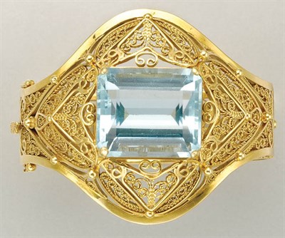 Lot 1062 - Gold and Aquamarine Bangle