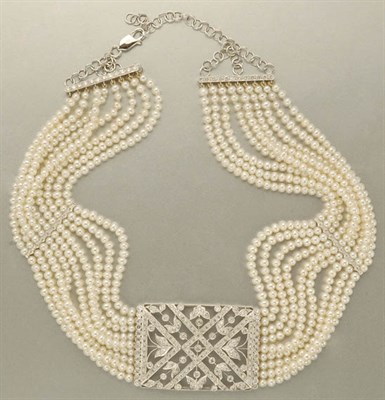 Lot 1275 - Nine Strand Cultured Pearl and Diamond Choker Necklace