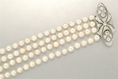 Lot 1218 - Four Strand Cultured Pearl Bracelet with Diamond Clasp
