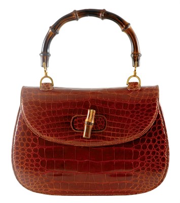 Lot 295 - Gucci Oversize Bamboo Handle Crocodile Handbag...
