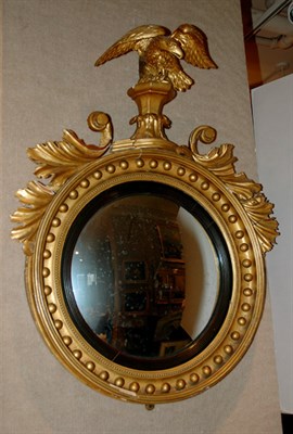 Lot 2279 - Classical Gilt-Wood Convex Mirror The circular...