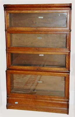 Lot 1124 - American Oak Four-Tier Barrister Bookcase...