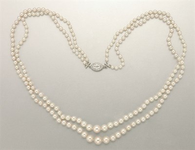 Lot 1361 - Double Strand Natural Pearl, Cultured Pearl and Diamond Necklace