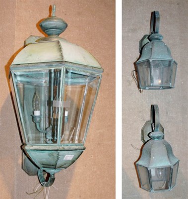 Lot 4182 - Three Patinated-Metal Lantern Style Sconces...