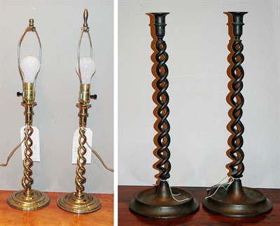 Lot 493 - Two Pairs of Brass Spiral Twist Candlesticks...