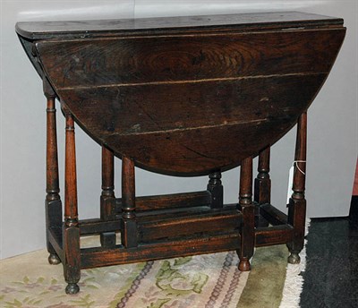 Lot 579 - Provincial George III Oak Drop-Leaf Gate Leg...