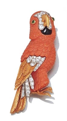 Lot 3589 - Gold, Carved Coral, Diamond, Emerald and Black Enamel Parrot Clip Brooch