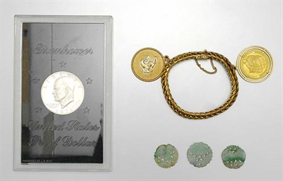 Lot 67 - Gold Charm Bracelet, U.S. Eisenhower Dollar and Carved Jade Fragments
