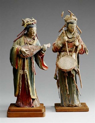 Lot 1171 - Two Chinese Painted Stucco Figures of Female...