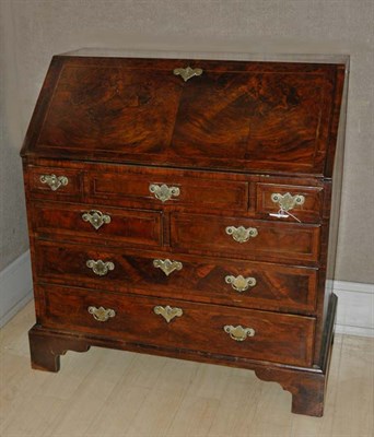 Lot 2257 - George I Walnut Bureau The rectangular top now...