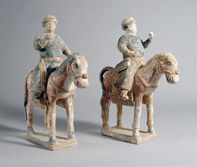 Lot 1118 - Two Chinese Painted Pottery Mounted Figures...