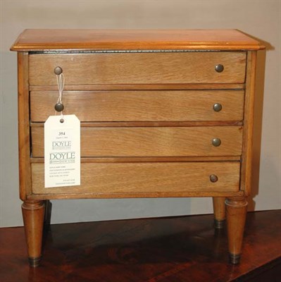 Lot 354 - Fruitwood Four-Drawer Miniature Chest of...