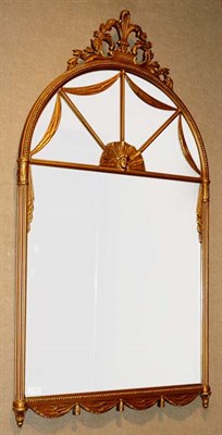 Lot 2358 - Art Deco Style Gilt-Wood Mirror The arched...