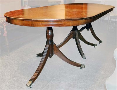 Lot 229 - Regency Style Banded Mahogany Triple-Pedestal...