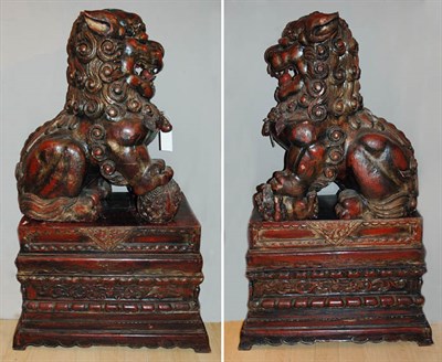 Lot 2491 - Pair of Chinese Carved and Red Painted Seated...